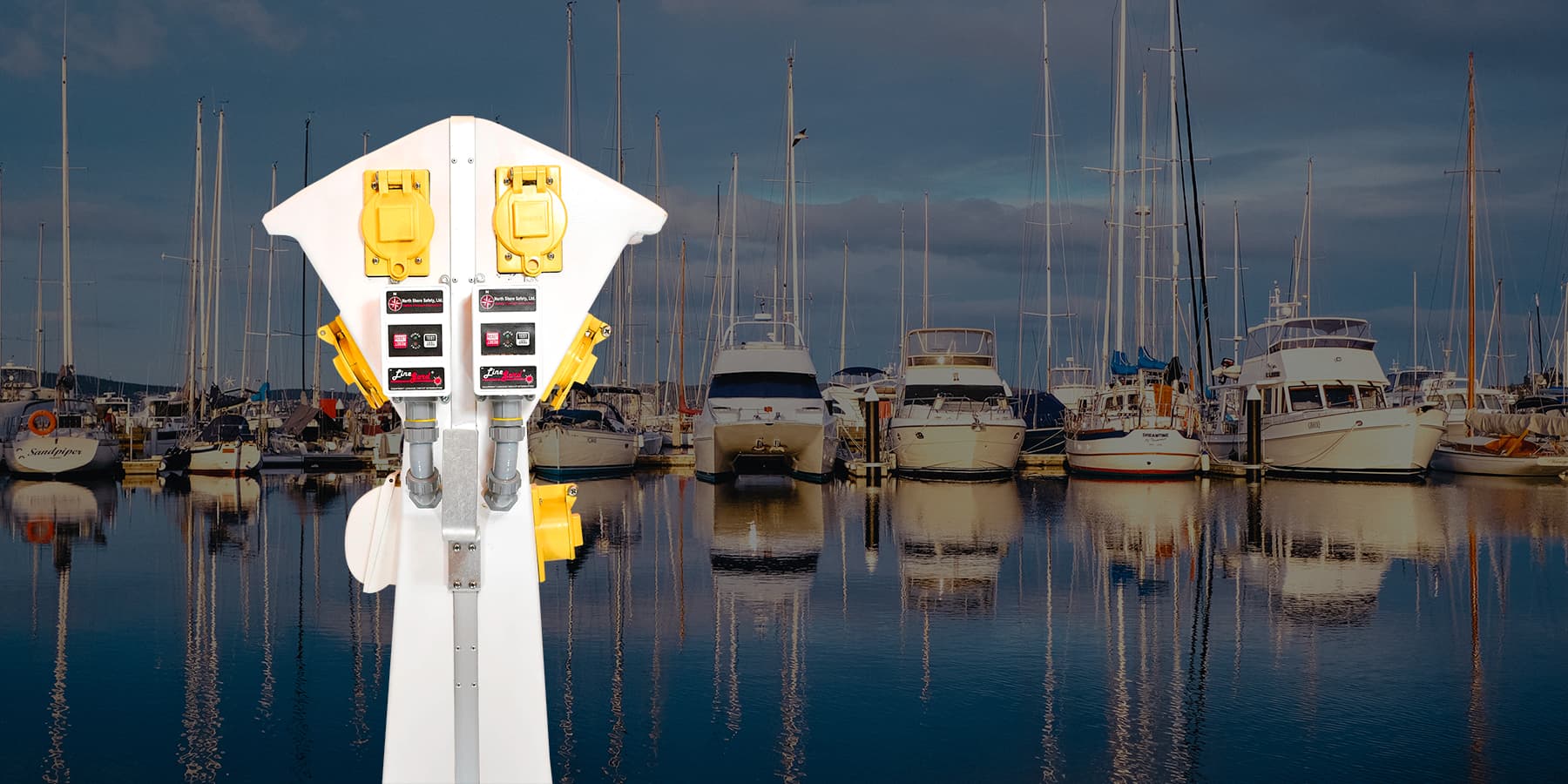 image of a marine pedestal equipped with North Shore Safety 30A ELCI in front of a marina