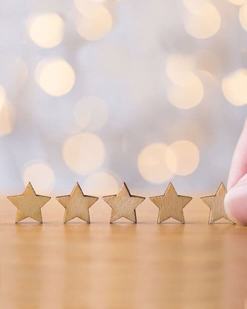 Five stars on a wooden surface