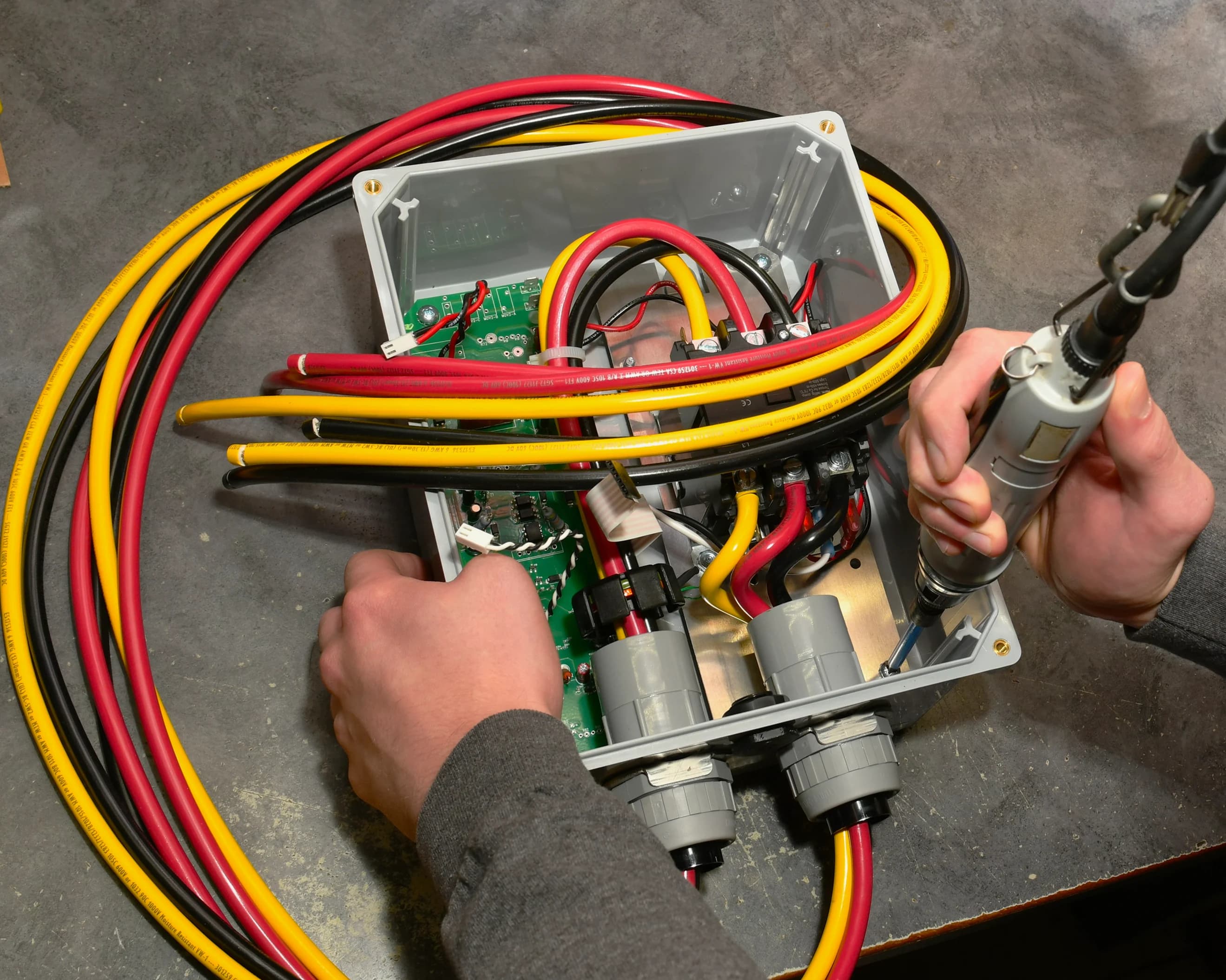 North Shore Safety team member assembling a GFCI product